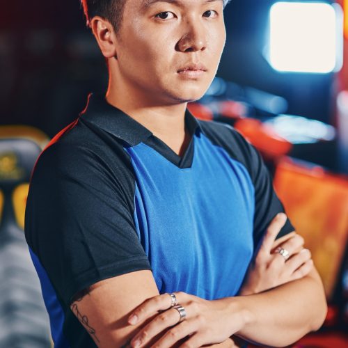 vertical-shot-of-young-asian-guy-male-cyber-sport-gamer-keeping-arms-crossed-and-looking-at-camera.jpg