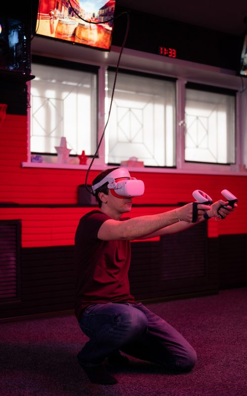 vr-game-and-virtual-reality-adult-man-gamer-in-3d-glasses-playing-on-shooting-simulation-video-game.jpg
